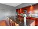 Beautiful kitchen with dark countertops, stainless steel appliances, wood cabinets, and an open layout at 101 Morris St # D, Durham, NC 27701