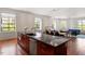 Gourmet kitchen with island featuring granite countertops and stainless steel appliances at 101 Morris St # D, Durham, NC 27701