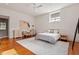 Bright bedroom featuring a seating area, modern decor, and ceiling fan at 101 Morris St # D, Durham, NC 27701