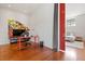 Home office with colorful geometric art and an adjacent bedroom space at 101 Morris St # D, Durham, NC 27701
