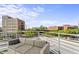 Comfortable rooftop deck seating area with views of the city skyline at 101 Morris St # D, Durham, NC 27701