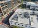 A stunning rooftop view showcasing a modern outdoor lounge area with cozy seating and city views at 101 Morris St # D, Durham, NC 27701