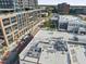 A stylish rooftop deck featuring modern furniture, creating an inviting outdoor lounge area with views at 101 Morris St # D, Durham, NC 27701