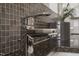 Close-up of a stylish bathroom sink with chrome fixtures and decorative backsplash at 101 Morris St # D, Durham, NC 27701