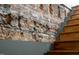 Staircase features exposed brick and light wood steps, blending rustic and modern design at 101 Morris St # D, Durham, NC 27701
