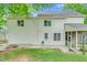 Exterior view of house with nice backyard firepit, lush greenery at 105 Parkmount Cir, Cary, NC 27519