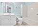Bright bathroom features white cabinets, white fixtures, and a shower tub at 105 Parkmount Cir, Cary, NC 27519