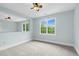 Bedroom with a light-colored wall and carpet, and a large window view at 105 Parkmount Cir, Cary, NC 27519