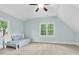 Cozy bedroom featuring a dormer window with natural light and plush carpeting at 105 Parkmount Cir, Cary, NC 27519