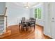 Dining room features hardwood floors, wainscoting, and a large window at 105 Parkmount Cir, Cary, NC 27519