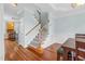 Bright entryway features a staircase with wood railing and hardwood floors at 105 Parkmount Cir, Cary, NC 27519