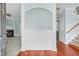 Home foyer featuring detailed molding, hardwood floors, columns, and entry to living room at 105 Parkmount Cir, Cary, NC 27519