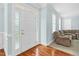 Foyer with hardwood flooring and decorative glass side panels on the front door at 105 Parkmount Cir, Cary, NC 27519