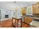 Open kitchen with stainless steel appliances, wood floors, granite countertops and eat-in area at 105 Parkmount Cir, Cary, NC 27519