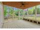 Relaxing screened porch with wood ceiling, fan, and backyard view at 105 Parkmount Cir, Cary, NC 27519