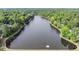 Aerial photo of the community's lake surrounded by trees and walking trails at 106 Birkhaven Dr, Cary, NC 27518