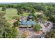 Overhead shot of the golf club featuring the clubhouse, parking area, and practice facilities at 106 Birkhaven Dr, Cary, NC 27518