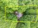 An aerial view of a home surrounded by lush greenery and trees showcasing its secluded lot at 106 Birkhaven Dr, Cary, NC 27518