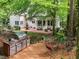Backyard deck with grill and table with the house and patio in the background at 106 Birkhaven Dr, Cary, NC 27518