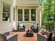 Charming brick patio with outdoor seating and lush greenery, great for relaxing outdoors at 106 Birkhaven Dr, Cary, NC 27518
