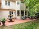 Backyard brick patio with fountain and seating, perfect for outdoor entertaining at 106 Birkhaven Dr, Cary, NC 27518