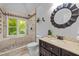 Modern bathroom featuring walk-in shower with tile surround and a vanity with bronze hardware at 106 Birkhaven Dr, Cary, NC 27518