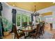 Beautiful dining room with hardwood floors, a bay window, and a view into another living space at 106 Birkhaven Dr, Cary, NC 27518