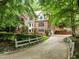 Elegant brick home with manicured landscaping, a private driveway, and multiple windows at 106 Birkhaven Dr, Cary, NC 27518