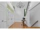 Elegant foyer with hardwood floors, a grand chandelier, and a staircase with iron railings at 106 Birkhaven Dr, Cary, NC 27518