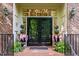 Elegant front door entrance with brick facade and decorative plants at 106 Birkhaven Dr, Cary, NC 27518