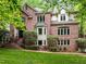 Beautiful two-story brick home with mature landscaping and manicured lawn at 106 Birkhaven Dr, Cary, NC 27518