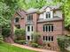 Attractive two-story brick home with manicured lawn and mature trees at 106 Birkhaven Dr, Cary, NC 27518