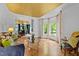 Cozy living room with hardwood floors, large windows, and a glimpse of the dining area at 106 Birkhaven Dr, Cary, NC 27518