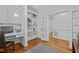 Functional office space with a built-in desk, shelving, and hardwood flooring at 106 Birkhaven Dr, Cary, NC 27518