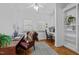 Bright office space featuring hardwood floors, natural light, and built-in bookshelves at 106 Birkhaven Dr, Cary, NC 27518