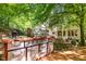 Outdoor kitchen with grill on the deck, overlooking the backyard, creating an ideal space for entertaining at 106 Birkhaven Dr, Cary, NC 27518
