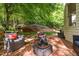 Cozy outdoor seating area on a brick patio with comfortable chairs, offering a relaxing outdoor retreat at 106 Birkhaven Dr, Cary, NC 27518