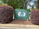 Lochmere Golf Club sign with a charming blue house illustration surrounded by lush landscaping at 106 Birkhaven Dr, Cary, NC 27518