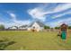 Expansive backyard with a play set and privacy fence at 106 Jj Dr, Benson, NC 27504