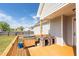 Backyard deck with an outdoor grill and dog houses at 106 Jj Dr, Benson, NC 27504