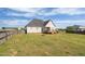 Spacious backyard with a privacy fence, fire pit and deck at 106 Jj Dr, Benson, NC 27504