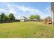 Spacious backyard with a large shed, wooden fence, and manicured lawn at 106 Jj Dr, Benson, NC 27504
