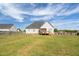 Wide open backyard with a privacy fence and deck at 106 Jj Dr, Benson, NC 27504