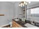 Modern bathroom featuring double sinks, granite countertops, and walk-in shower at 106 Jj Dr, Benson, NC 27504