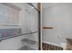 Modern bathroom featuring a glass shower and gray tiling at 106 Jj Dr, Benson, NC 27504