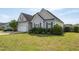 Attractive house with a well-kept lawn, neat shrubbery, and an attached two-car garage at 106 Jj Dr, Benson, NC 27504