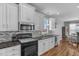 Bright kitchen features granite countertops, stainless steel appliances, and ample cabinet space at 106 Jj Dr, Benson, NC 27504