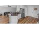 Spacious kitchen with granite countertops, stainless steel fridge, and hardwood floors at 106 Jj Dr, Benson, NC 27504