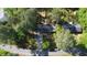 Aerial view showcasing the roof, driveway, and lush, mature landscaping surrounding the property at 109 Edgewood Dr, Louisburg, NC 27549