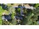 An aerial view of the home surrounded by mature trees and a long driveway at 109 Edgewood Dr, Louisburg, NC 27549
